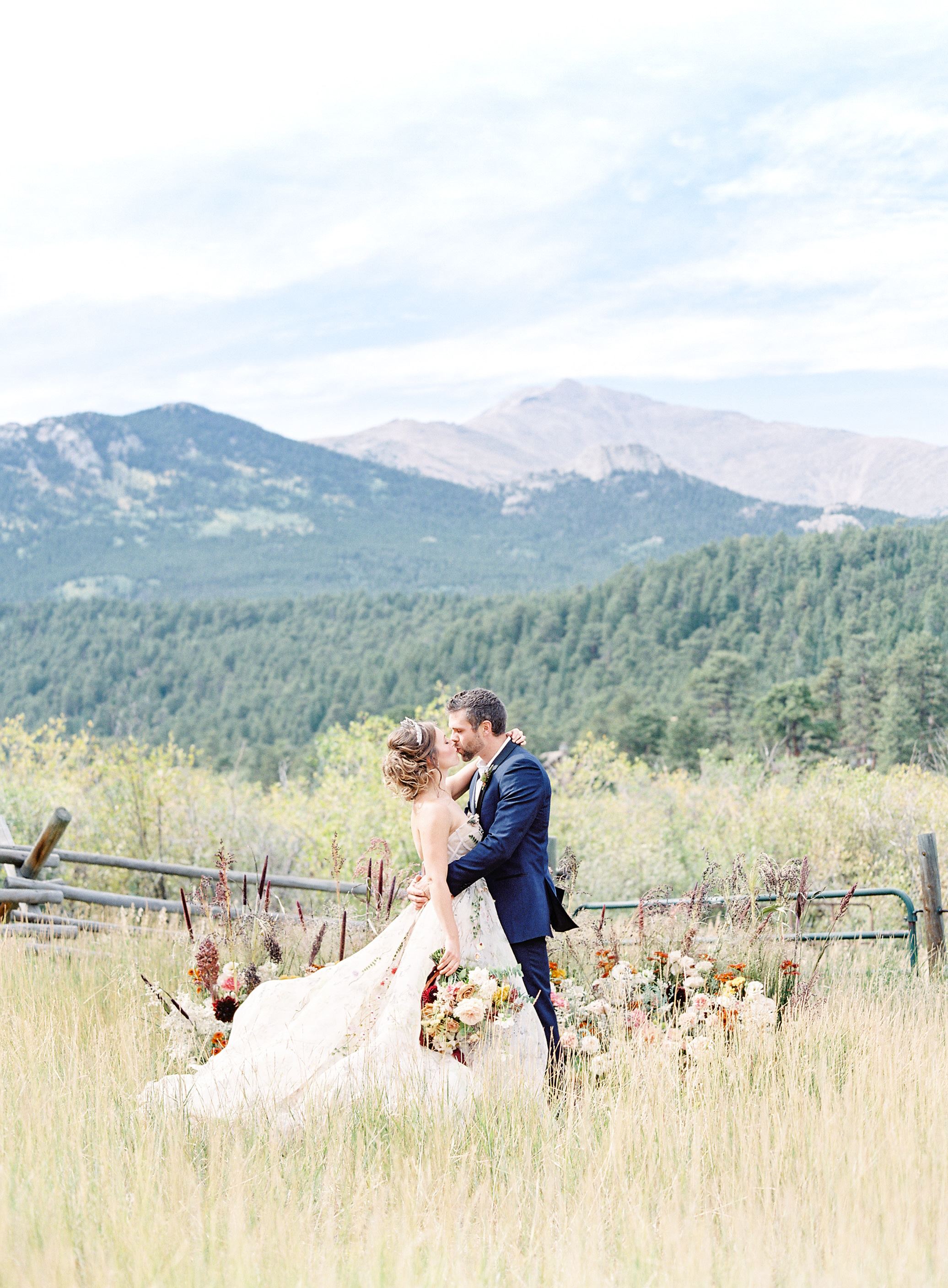 A couple getting married in spring or summer at the Wild Basin Lodge venue in Allespark, Colorado.