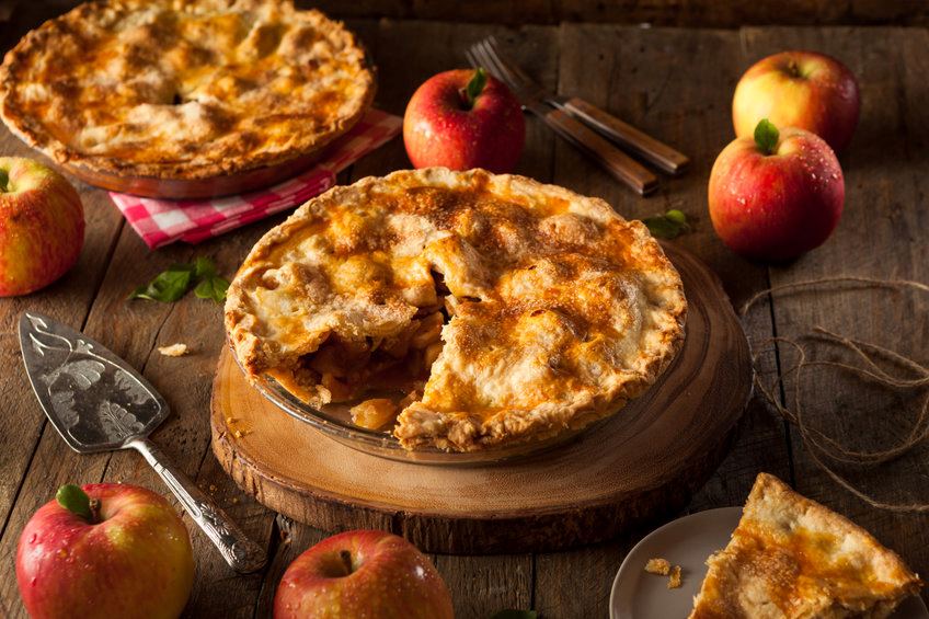 An arrangement of delicious-looking apple pies.