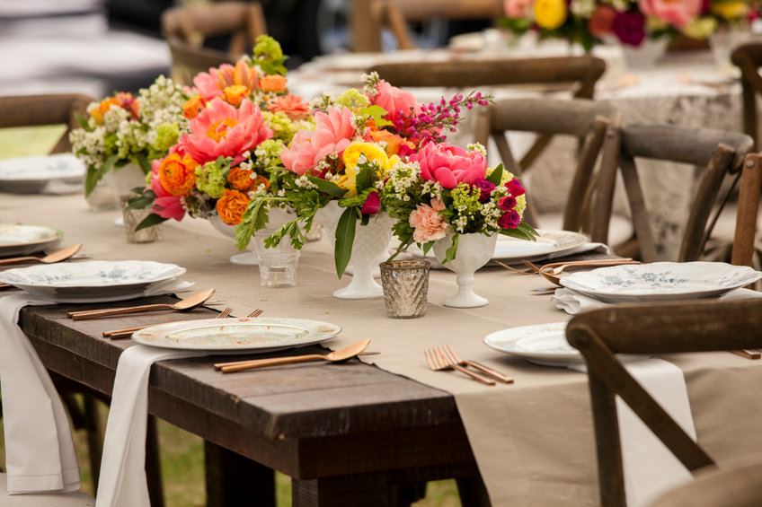 Where are you going to host your at-home wedding dinner? You have options. You can set up tables inside or in your yard.